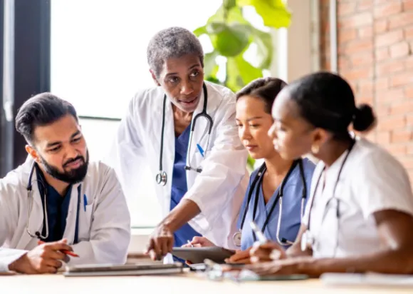 Wound care nurses studying together