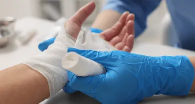 Nurse wrapping hand
