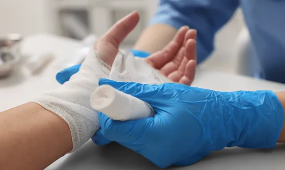 Nurse wrapping hand